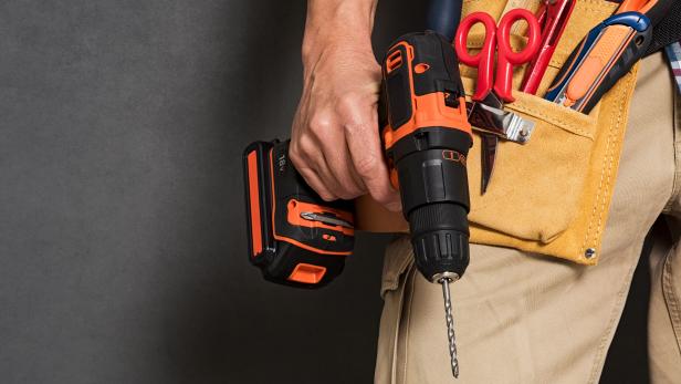 Hand holding construction tools