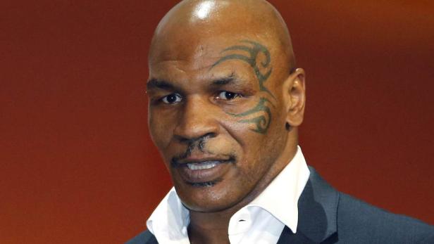 Mike Tyson poses after receiving the Sportel Speci