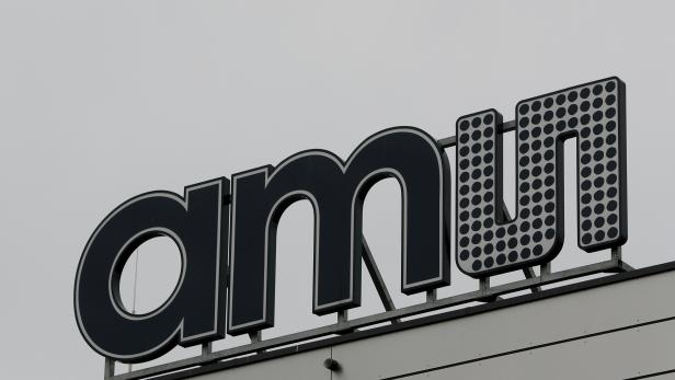 FILE PHOTO: The Logo of Austrian sensor specialist AMS is seen on their factory in Unterpremstaetten