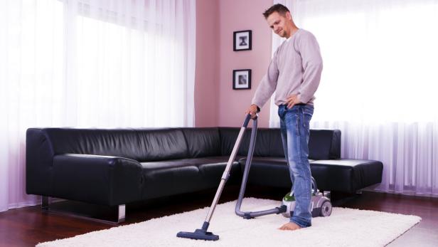 He cleaned the carpet, vacuum cleaner.