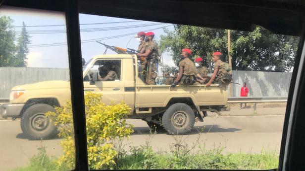 Ethiopian military ride on their pick-up truck as they patrol the streets following protests in Addis Ababa