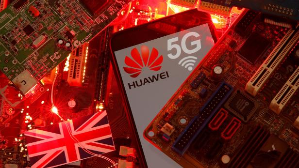 FILE PHOTO: The British flag and a smartphone with a Huawei and 5G network logo are seen on a PC motherboard in this illustration