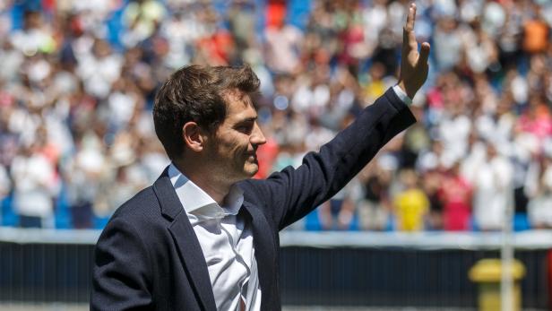 Departing Real Madrid captain and goalkeeper Iker Casillas waves to supporters at official send-off at Bernabeu stadium in Madrid, Spain