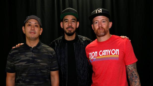 Linkin Park members Hahn, Shinoda and Farrell pose backstage at the end of the "Linkin Park & Friends Celebrate Life in Honor of Chester Bennington" concert at Hollywood Bowl in Los Angeles