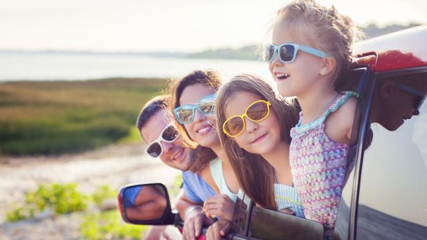 Portrait of a smiling family with two children at beach