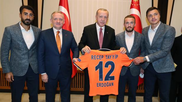 Turkey's President Erdogan poses with players of Turkish Superlig champion Istanbul Basaksehir soccer team at the Presidential Palace in Ankara