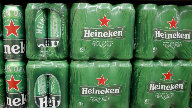 FILE PHOTO: Cans of Heineken beer are displayed at a supermarket of Swiss retailer Denner in Glattbrugg