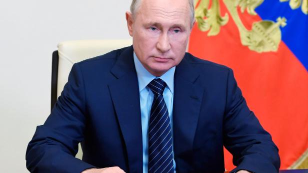 Russia's President Putin takes part in a a video conference call outside Moscow