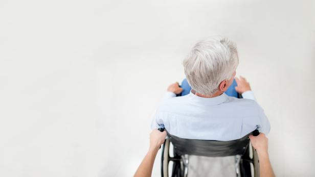 Senior man in a wheelchair at the hospital