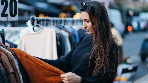 Young woman shopping in London second hand marketplace