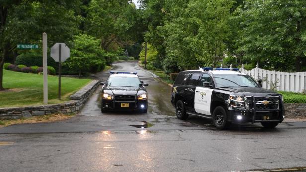 Police block the private drive leading to the Warmbier residence in the Wyoming neighborhood of Cincinnati