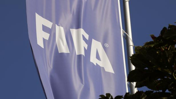 A flag with the logo of FIFA flies in front of its headquarters in Zurich