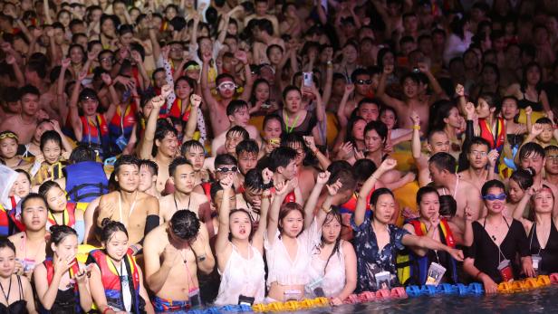 People enjoy a music party at the Wuhan Maya Beach Park, in Wuhan, following the coronavirus disease (COVID-19) outbreak