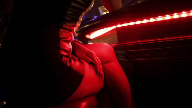 A woman waits in a nightclub in Salzburg