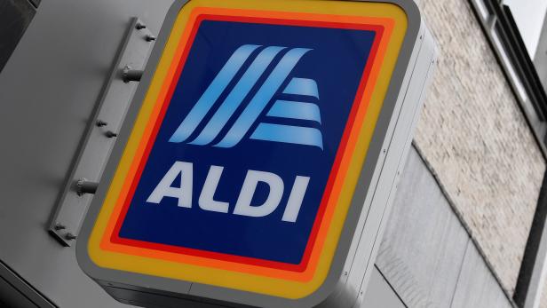 Signage is seen at a branch of Aldi Local, London
