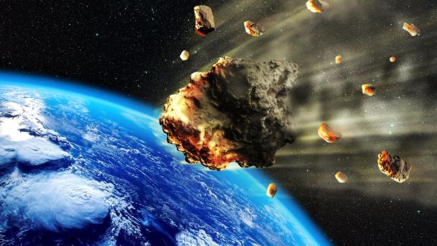 Ein Symbolbild. Im ungünstigsten Fall könnte der neu entdeckte Meteorit in ferner Zukunft mit der Erde kollidieren und sie verwüsten.