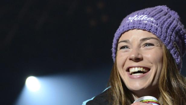 epa03584172 Silver medal winner Tina Maze of Slovenia celebrates on the podium during the medal ceremony of the women&#039;s Giant Slalom race at the Alpine Skiing World Championships in Schladming, Austria, 14 February 2013. EPA/HELMUT FOHRINGER