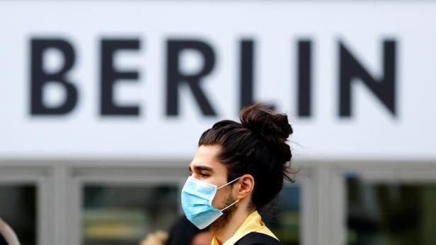 A man wearing a face mask is pictured at Schloss Strasse shopping street as the coronavirus disease (COVID-19) outbreak continues in Berlin