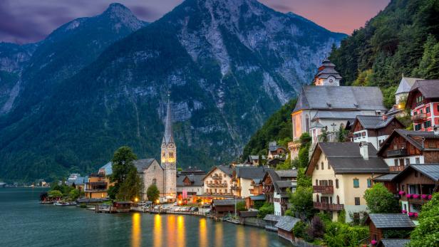 Hallstatt village in Alps and lake at dusk, Austria, Europe