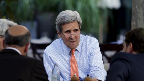 Kerry, Sherman, Malley and Finer meet on the terrace of a hotel where the Iran nuclear talks meetings are being held in Vienna