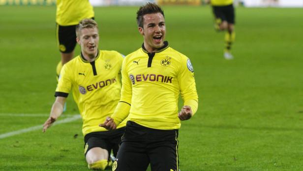 Goetze and Reus of Borussia Dortmund celebrate Goe
