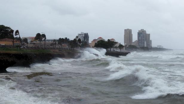 Waves crash along the shores of the Malecon in San