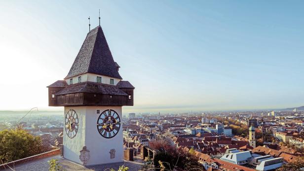 Historical Clock tower Uhrturm and old town in Graz, Austria
