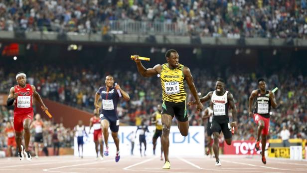 Bolt of Jamaica crosses to finish line to win the