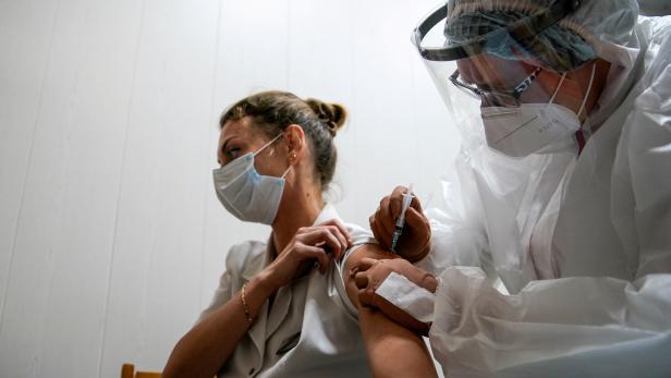 FILE PHOTO: A medic of the regional hospital receives  Russia's "Sputnik-V" vaccine shot against the coronavirus disease (COVID-19) in Tver