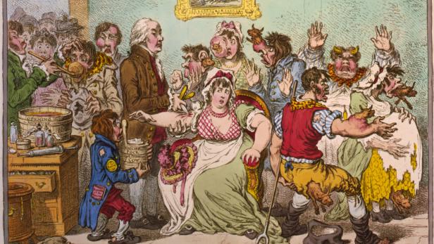 Karikatur aus 1802: Impfgegner, die befürchten, durch die Pocken-Vakzination zu Kühen zu werden, umringen den Arzt Edward Jenner
