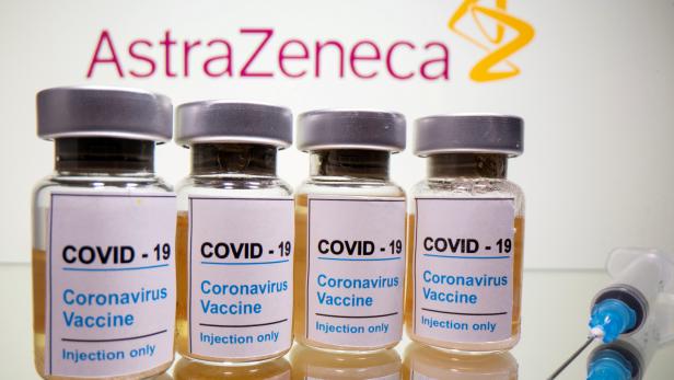 FILE PHOTO: FILE PHOTO: FILE PHOTO: FILE PHOTO: FILE PHOTO: FILE PHOTO: Vials and medical syringe are seen in front of AstraZeneca logo in this illustration