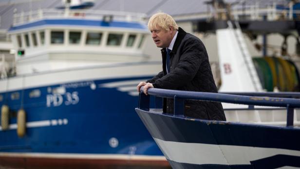 FILE PHOTO: Britain's Prime Minister Boris Johnson is seen aboard the Opportunus IV fishing trawler in Peterhead