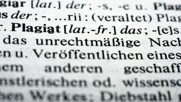 Extreme close up of english dictionary, word plagiat