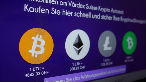 FILE PHOTO: The exchange rates of Bitcoin, Ether, Litecoin and Bitcoin Cash are seen on the display of a cryptocurrency ATM at the headquarters of Swiss Falcon Private Bank in Zurich