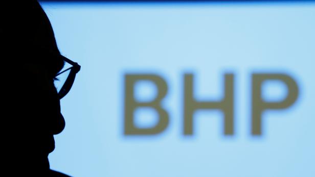 FILE PHOTO: BHP's company logo is projected on a screen at a meeting in Tokyo, Japan, June 5, 2017