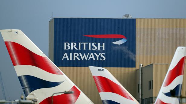 FILE PHOTO: British Airways logos are seen on tail fins at Heathrow Airport in west London