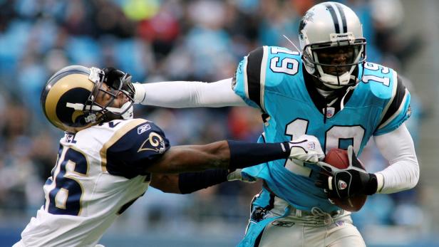 FILE PHOTO: Carolina Panthers Johnson pushes off Hill against Rams in Charlotte