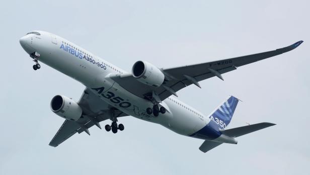 FILE PHOTO: An Airbus A350-900 aircraft performs a flight pass during the Singapore Airshow in Singapore