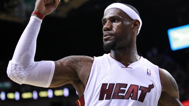 Miami Heat small forward LeBron James reacts after his second quarter dunk against the New York Knicks during Game 2 of their first round NBA Eastern Conference basketball playoff in Miami, Florida April 30, 2012. REUTERS/Andrew Innerarity (UNITED STATES - Tags: SPORT BASKETBALL)