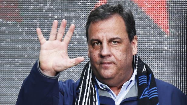 Christie waves to guests as he attends the Super B
