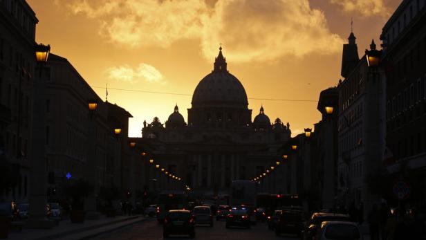 Saint Peter&#039;s Basilica at the Vatican is silhouetted during sunset in Rome in this March 11, 2013 file photo. Pope Francis, who has said he wants the Catholic Church to be a model of austerity and honesty, could restructure or even close the Vatican&#039;s scandal-ridden bank as part of a broad review of its troubled bureaucracy, Vatican sources say. To match Insight POPE-BANK/ REUTERS/Paul Hanna/Files (ITALY - Tags: RELIGION CITYSCAPE)