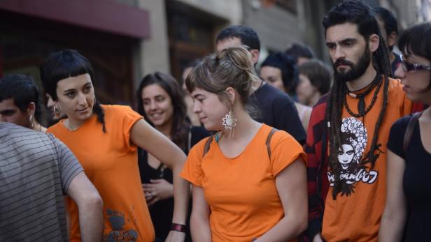 Members and supporters of the Uribarri Piztu (Light up Uribarri) collective take part in a news conference in front of an industrial building, renamed by them &quot;Patakon&quot;, in the working class neighbourhood of Uribarri in Bilbao June 26, 2012. Basque police entered the building early Tuesday, occupied since the beginning of June by young people from the area, and sealed the doors following a court order. Uribarri Pitzu spokesman Andoni Alvarez told Reuters, &quot;If the town Council has no money to spend in times of economic crisis, why are they throwing us out of a building that has been empty for 50 years, when we have a cultural project that will cost not one euro of public money?&quot;. Running at 50 per cent, youth unemployment in Spain is the highest rate in Europe. REUTERS/Vincent West (SPAIN - Tags: POLITICS CIVIL UNREST BUSINESS SOCIETY)