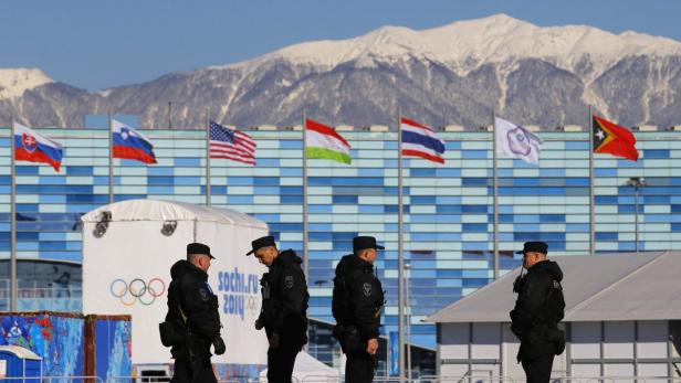 Security personnel patrol the Olympic Park at the