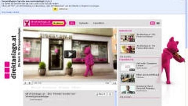 Ein Screenshot von YouTube mit einem Video von direktanlage.at und einer pinkfarbenen Bärenfigur.