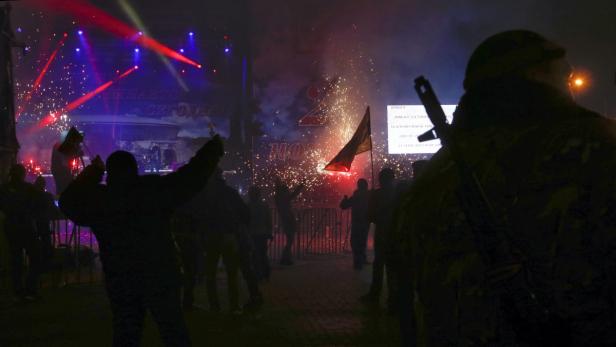 People celebrate the end of voting day for the lea