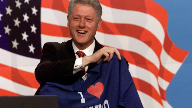 US PRESIDENT BILL CLINTON SMILES AS HE SHOWS OFF A