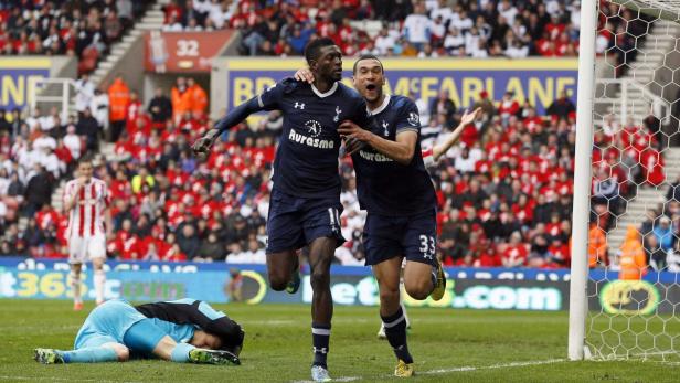 Tottenham Hotspur&#039;s Emmanuel Adebayor (C) celebrates next to team mate (R) Steven Caulker after scoring against Stoke City during their English Premier League soccer match at the Britannia Stadium in Stoke-on-Trent, central England May 12, 2013. REUTERS/Stefan Wermuth (BRITAIN - Tags: SPORT SOCCER TPX IMAGES OF THE DAY) NO USE WITH UNAUTHORIZED AUDIO, VIDEO, DATA, FIXTURE LISTS, CLUB/LEAGUE LOGOS OR &quot;LIVE&quot; SERVICES. ONLINE IN-MATCH USE LIMITED TO 45 IMAGES, NO VIDEO EMULATION. NO USE IN BETTING, GAMES OR SINGLE CLUB/LEAGUE/PLAYER PUBLICATIONS. FOR EDITORIAL USE ONLY. NOT FOR SALE FOR MARKETING OR ADVERTISING CAMPAIGNS