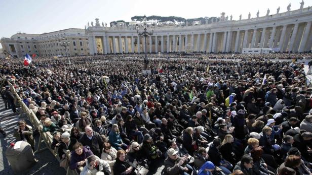The crowd listens to Pope Benedict XVI in St Peter