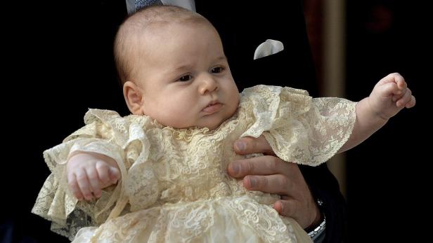 Britain's Prince William carries his son Prince Ge
