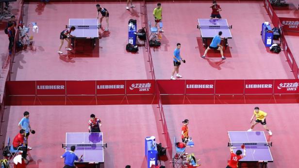 Competitors train before the start of the men&#039;s single qualifying rounds at the World Team Table Tennis Championships in Paris May 13, 2013. The 52nd edition of the World Table Tennis Championships gathers 829 athletes from 162 countries runs from May 13 to May 20. REUTERS/Charles Platiau (FRANCE - Tags: SPORT TABLE TENNIS)